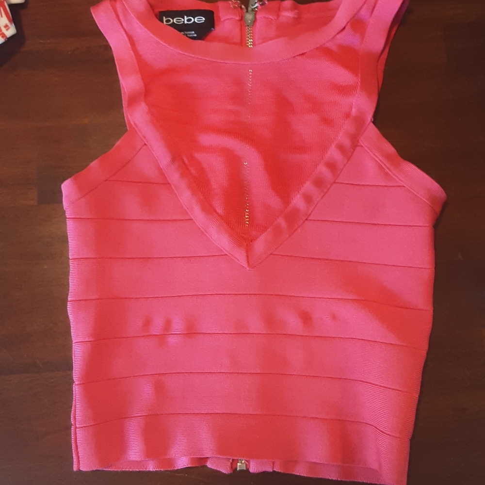 Gorgeous pink BEBE bandage stretch & mesh zip crop